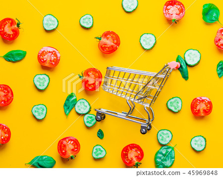 tomatoes, cucumbers and basil with shopping cart  45969848