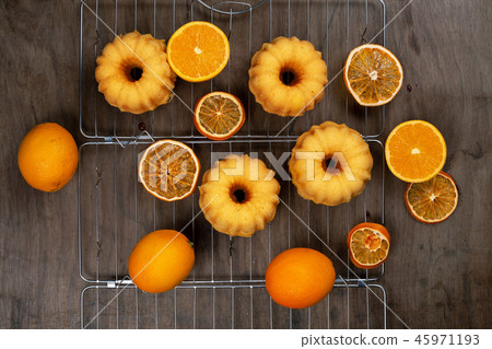 Small orange bundt cakes  Small orange bundt cakes  45971193