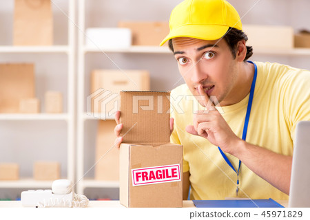 Handsome contractor working in box delivery relocation service  45971829