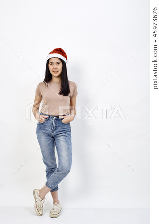 Christmas girl in santa hat on a white 45973676