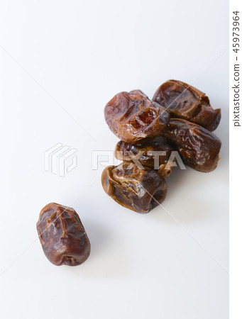 Dried halawi dates on a white Dried halawi dates on a white 45973964