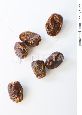 Dried halawi dates on a white Dried halawi dates on a white 45973966