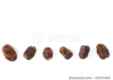 Dried halawi dates on a white Dried halawi dates on a white 45973968