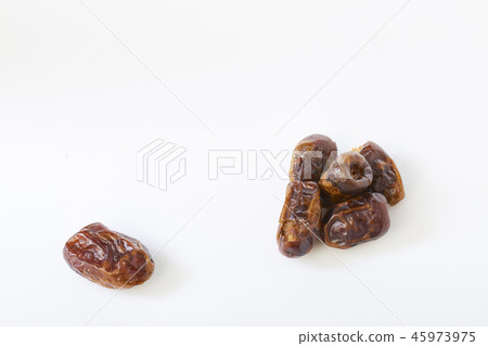 Dried halawi dates on a white Dried halawi dates on a white 45973975