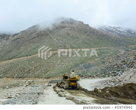 Excavator loader machine at mountain road 45974991