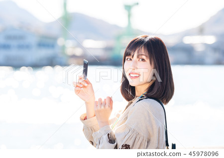 Women's Journey Onomichi instant camera at the seaside 45978096