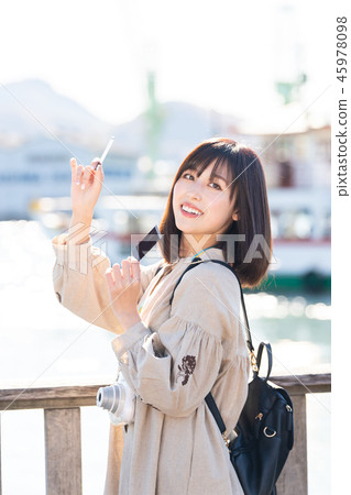 Women's Journey Onomichi instant camera at the seaside 45978098