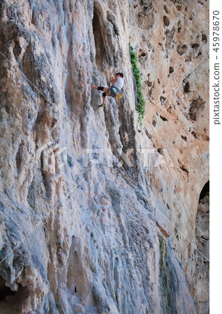woman rock climbing on karst white mountain woman rock climbing on karst white mountain 45978670