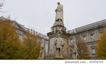 Autumn leaves of Milan Leonardo da Vinci statue Scala Square 45979335