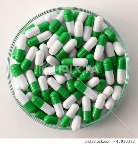 Tablets scattered on the table of the 45980358