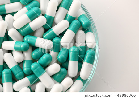 Tablets scattered on the table of the 45980360