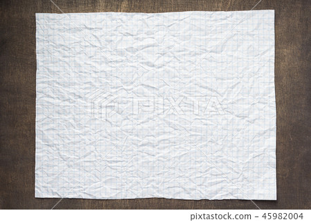 empty checked wrinkled paper at wood 45982004
