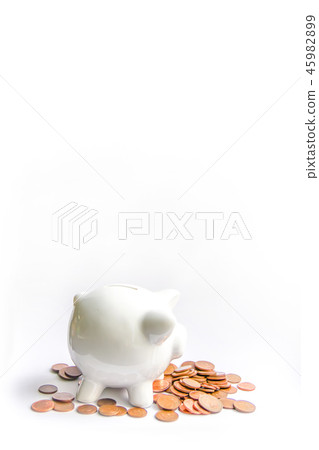Piggy bank with coins. White ceramic moneybox. 45982899