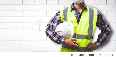 Worker is building a brick wall. Worker is building a brick wall. 45988725