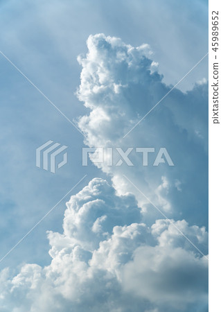 Vertical shot of towering cumulus clouds Vertical shot of towering cumulus clouds 45989652