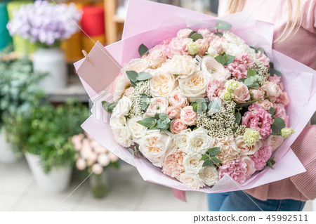 European floral shop. Bouquet of beautiful Mixed flowers in woman hand. Excellent garden flowers in 45992511