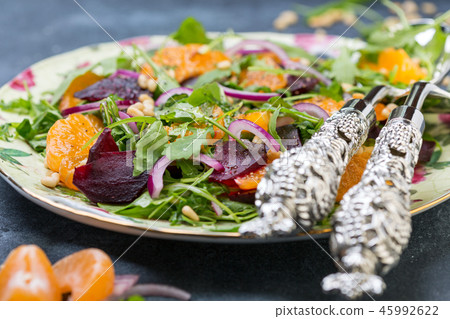 Salad of arugula, tangerines and beets close-up. 45992622