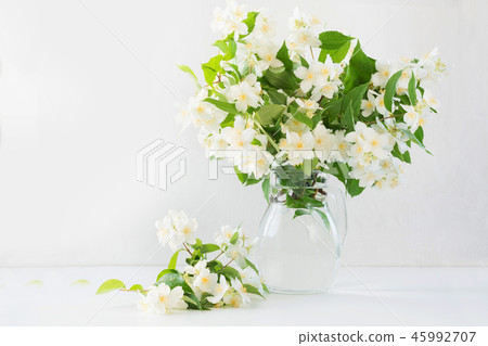 Beautiful bouquet of jasmine flowers in vase. 45992707