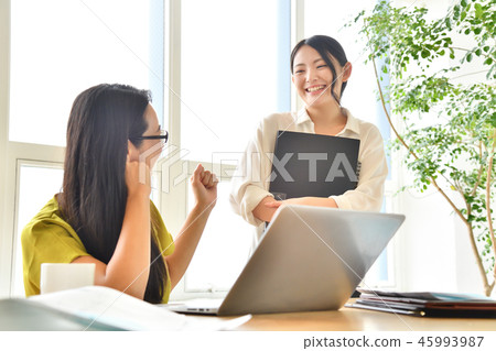 Two women in creative work meeting office Two women in creative work meeting office 45993987