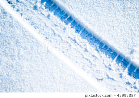 Car tires on winter road 45995887