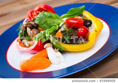 Peppers filled with porcini mushrooms, rice, tomatoes Peppers filled with porcini mushrooms, rice, tomatoes 45999009
