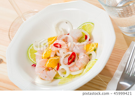 Ceviche with shrimps, lime, tangerine and hot pepper 45999421