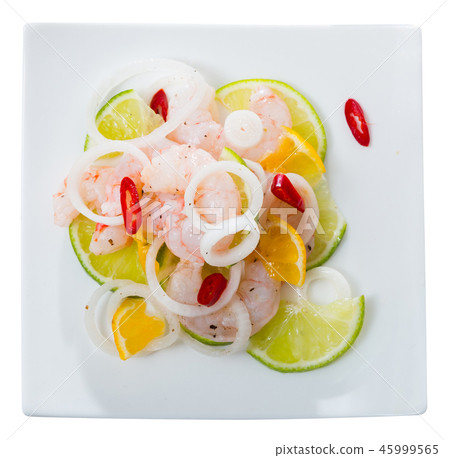 Top view of shrimp ceviche with lime, tangerine and hot pepper 45999565