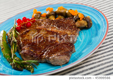 Steak entrecote of beef with mushroom and asparagus at plate 45999566