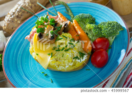 Plate of appetizing baked potato 45999567