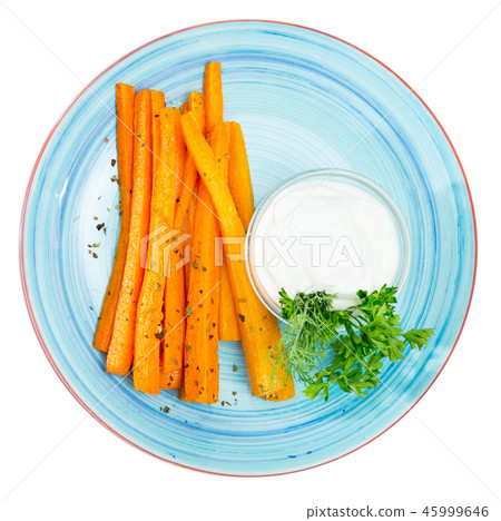 Tasty fried carrot sticks and served with sour cream at plate Tasty fried carrot sticks and served with sour cream at plate 45999646
