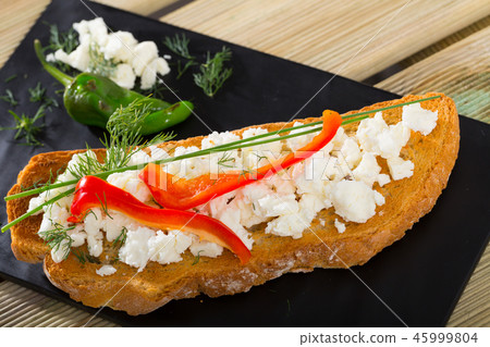 Bruschetta with fresh cheese and pepper Bruschetta with fresh cheese and pepper 45999804