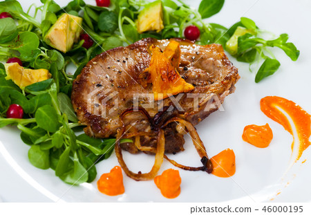 Grilled pork chop with greens and squash puree Grilled pork chop with greens and squash puree 46000195