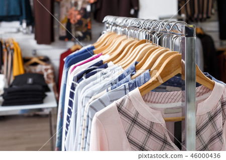 Fashion clothes on hangers and shelfs Fashion clothes on hangers and shelfs 46000436