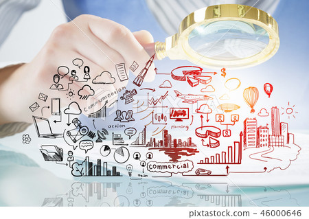 Businessperson examining business plan 46000646