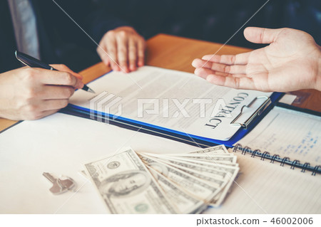 Business people negotiating a contract handshake Business people negotiating a contract handshake 46002006