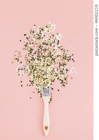 Surreal Paint brush drawing golden stars confetti 46002219