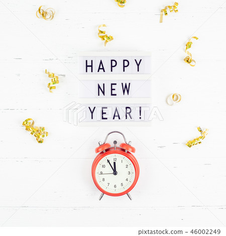 New Year composition alarm clock golden confetti New Year composition alarm clock golden confetti 46002249