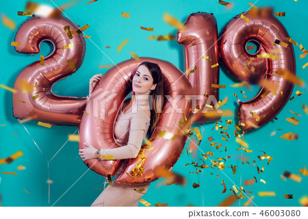 Happy new year and Merry Christmas Beautiful young woman with balloons 2019. 46003080