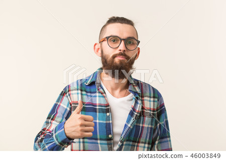 Gesture, fashion and people concept - Bearded hipster man with thumb up on white background Gesture, fashion and people concept - Bearded hipster man with thumb up on white background 46003849