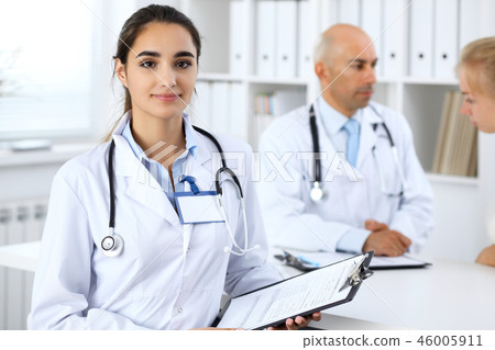 Portrait of young doctor woman in hospital. Hispanic or latin american staff in medicine Portrait of young doctor woman in hospital. Hispanic or latin american staff in medicine 46005911
