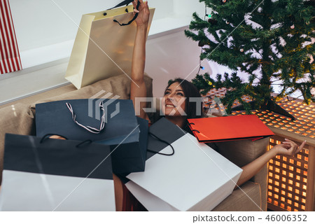 Young woman at home in winter holidays. Christmas and New Year 46006352