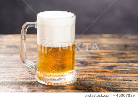 Food and drink concept - Glass beer on wood background with copy space 46007859