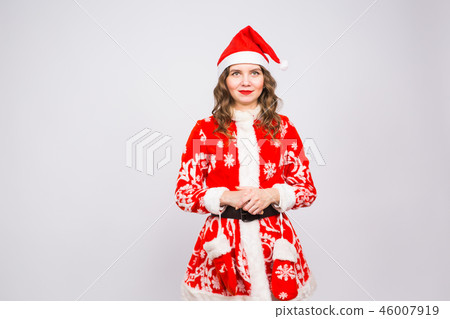 Christmas, fun and holidays concept - funny woman in santa costume on white background with copy Christmas, fun and holidays concept - funny woman in santa costume on white background with copy 46007919