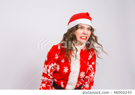 Christmas, emotions and people concept - angry woman in santa claus clothes on white background Christmas, emotions and people concept - angry woman in santa claus clothes on white background 46008243