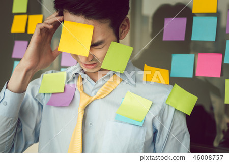 Stressful businessman with adhesives notes on his body 46008757