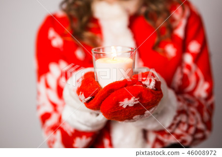 Christmas, celebration, people concept - Close up of Young charming woman in a Santa suit is holding Christmas, celebration, people concept - Close up of Young charming woman in a Santa suit is holding 46008972