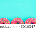 Bright tasty pink glazed donuts doughnuts on blue  46010347