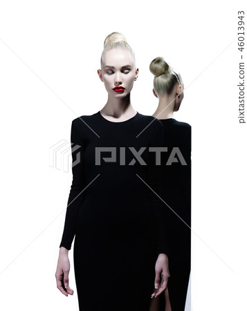 Elegant blonde and her reflection in the mirror 46013943