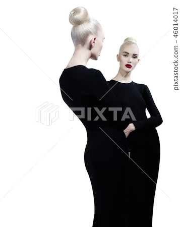 Elegant blonde and her reflection in the mirror Elegant blonde and her reflection in the mirror 46014017