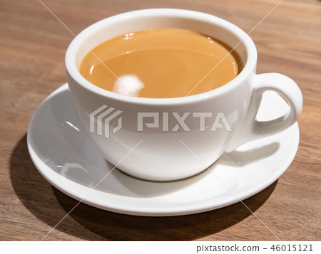 White coffee cup on plate 46015121